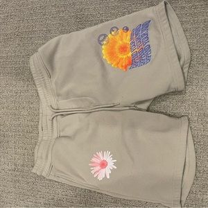 tan shorts with flower decals